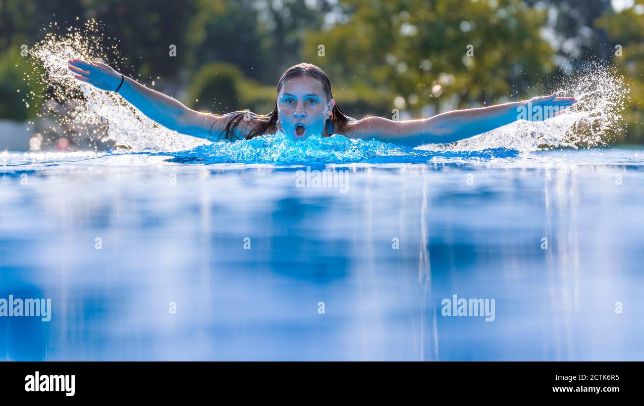 Woman swimming in pool water hi-res stock photography and images - Alamy