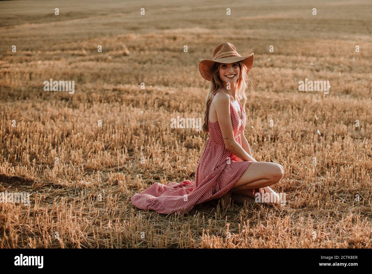 Woman in dress kneeling on hi-res stock photography and images - Alamy