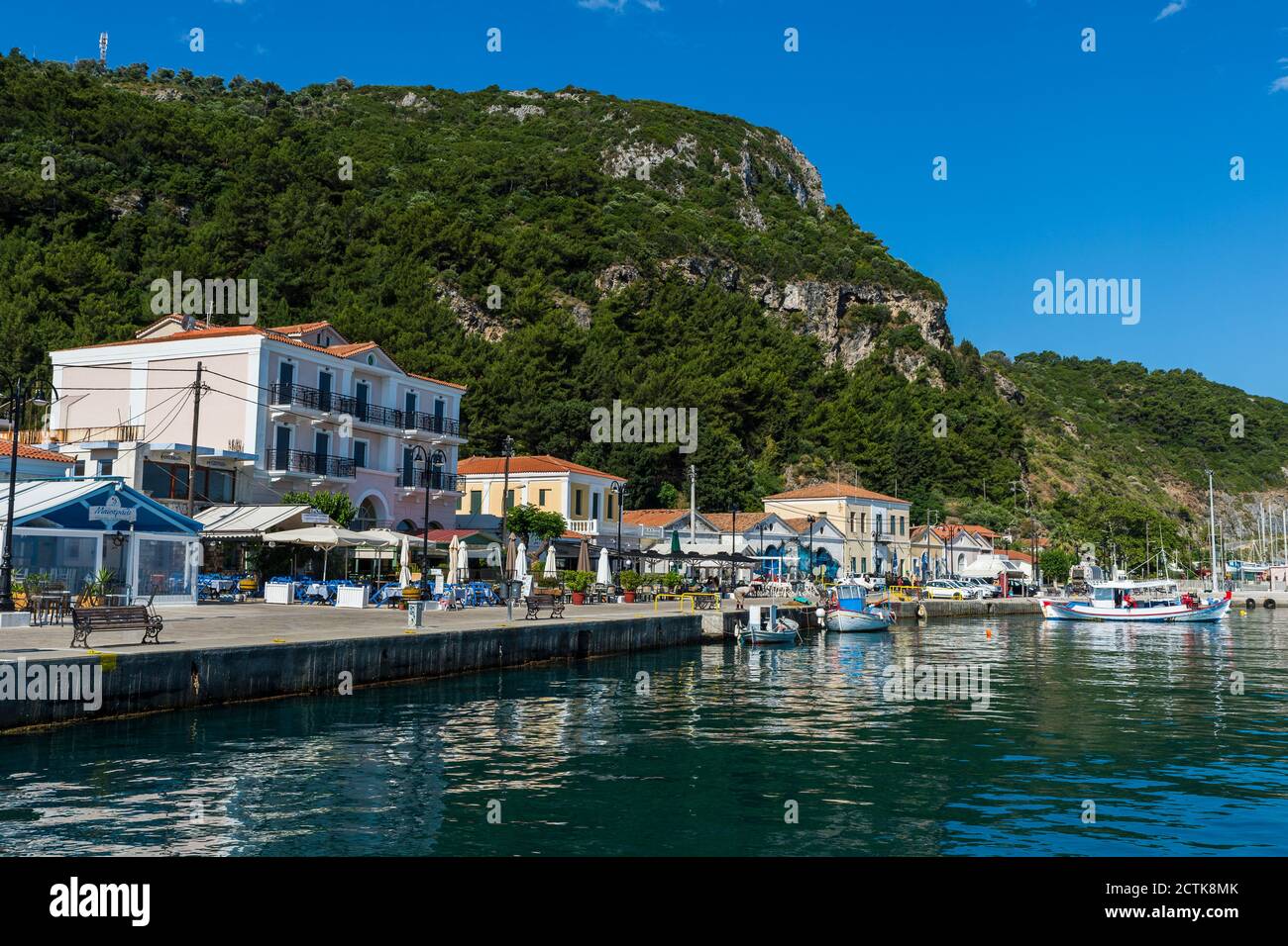 Greece, North Aegean, Karlovasi, Coastal town in summer with mountain in background Stock Photo