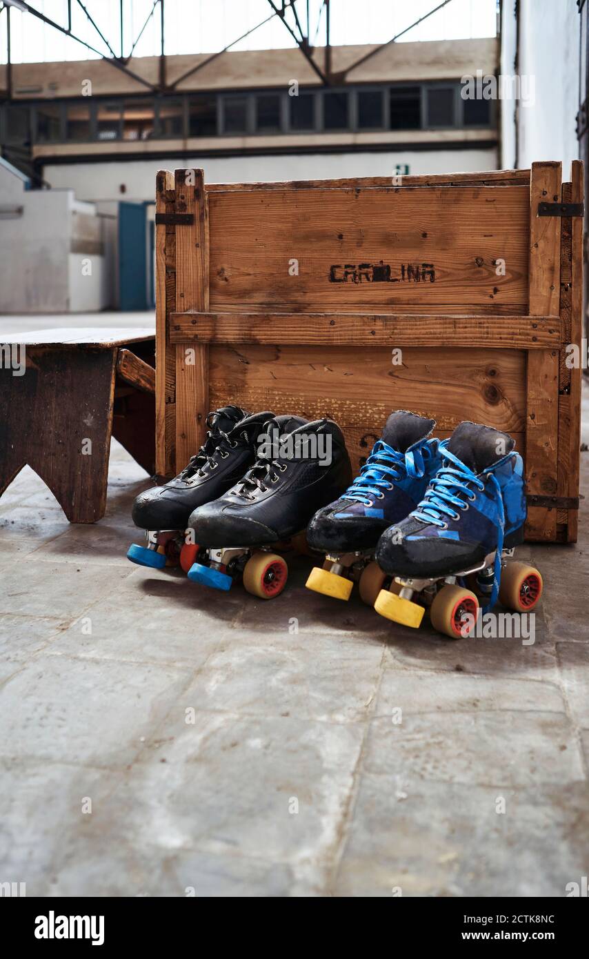 Roller skates against wooden box on sports court Stock Photo