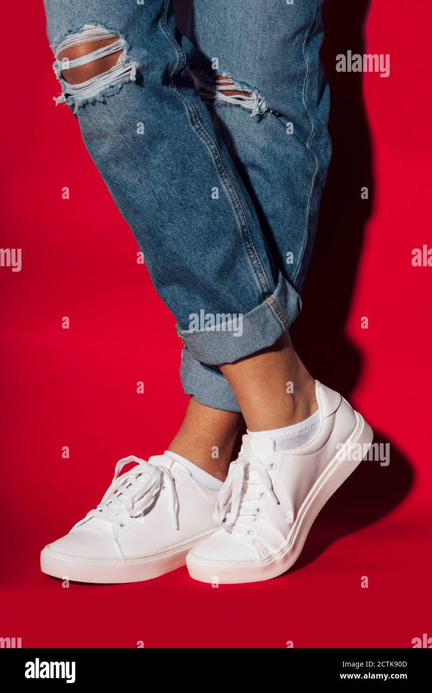Wearing white sneakers hi-res stock photography and images