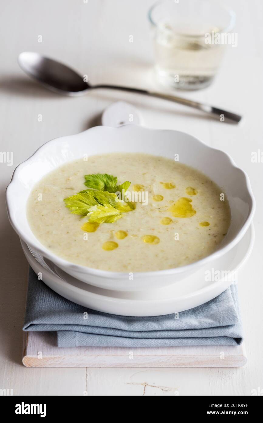 Bowl of vegetarian cream soup with oats and celery Stock Photo