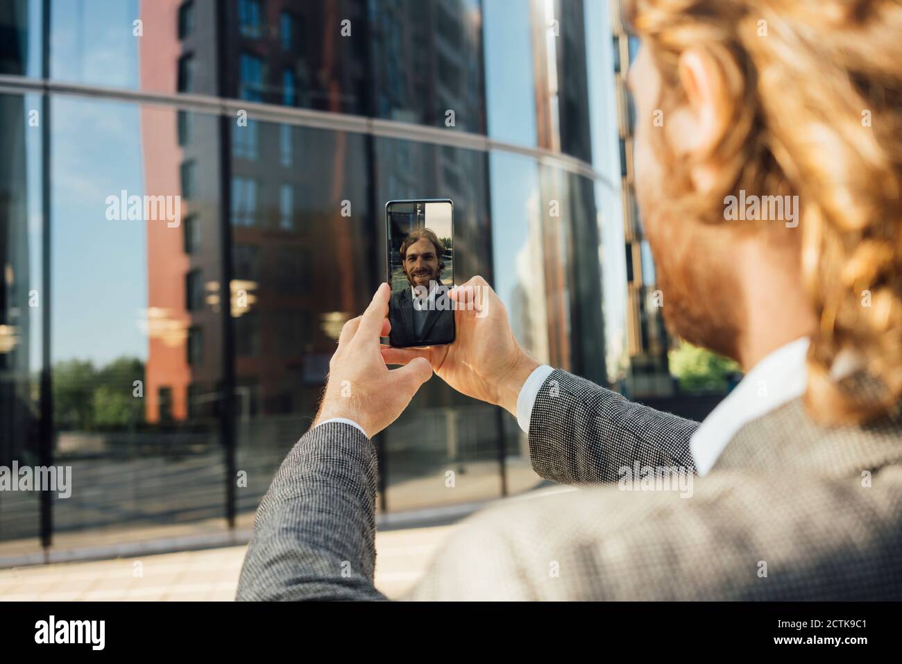Young businessman taking selfie at downtown district Stock Photo