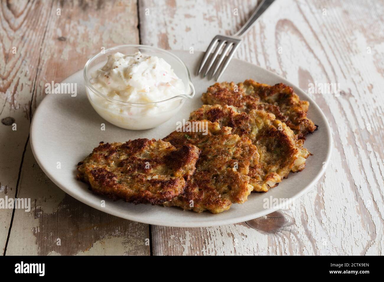 Rye and turnip pancakes with sour cream-yogurt dipping sauce Stock Photo