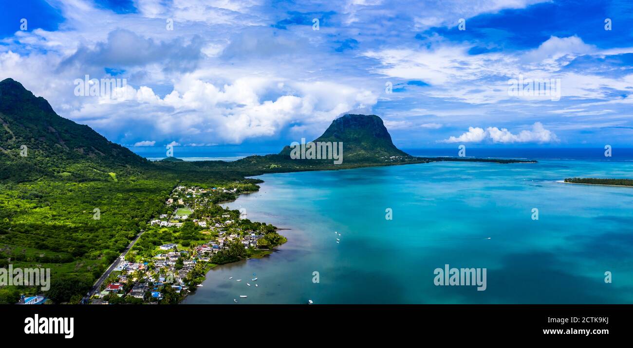 Mauritius, Black River, Tamarin, Helicopter view of coastal village with Le Morne Brabant mountain in background Stock Photo