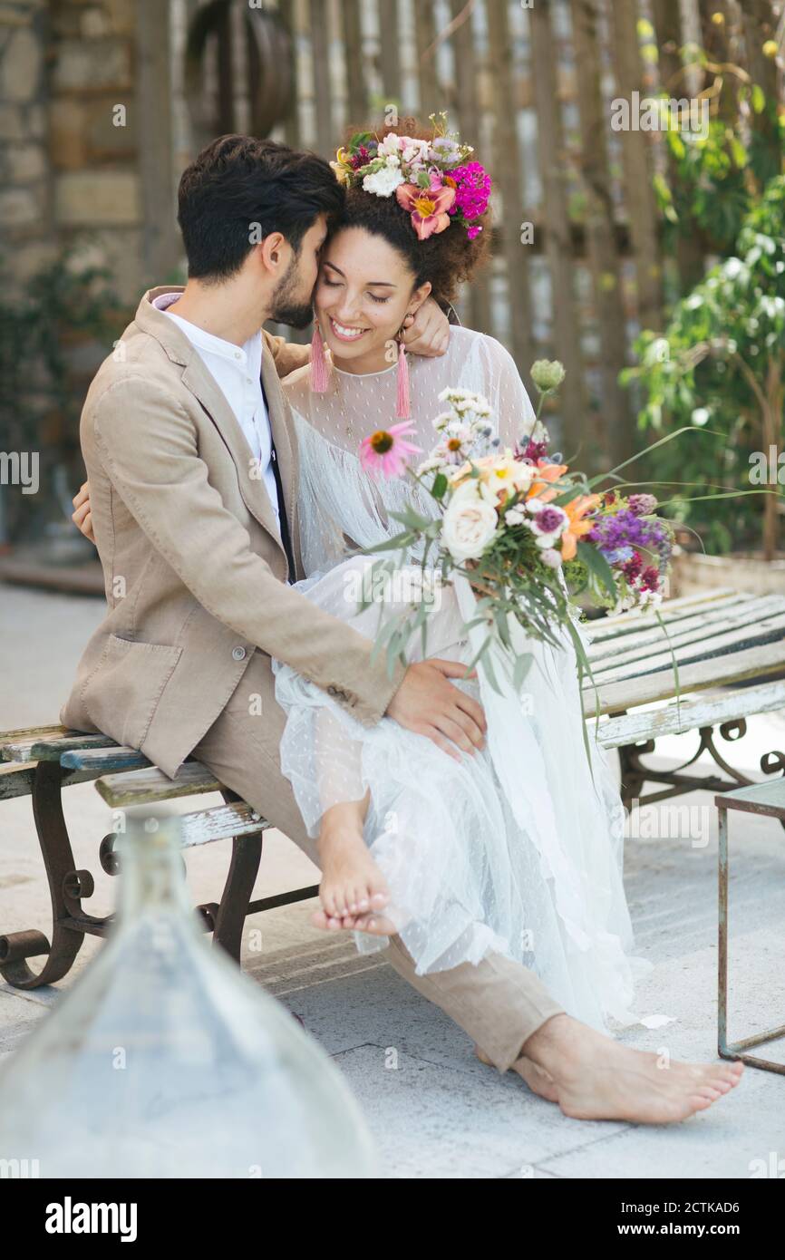 Bride sitting on lap groom hi-res stock photography and images - Alamy