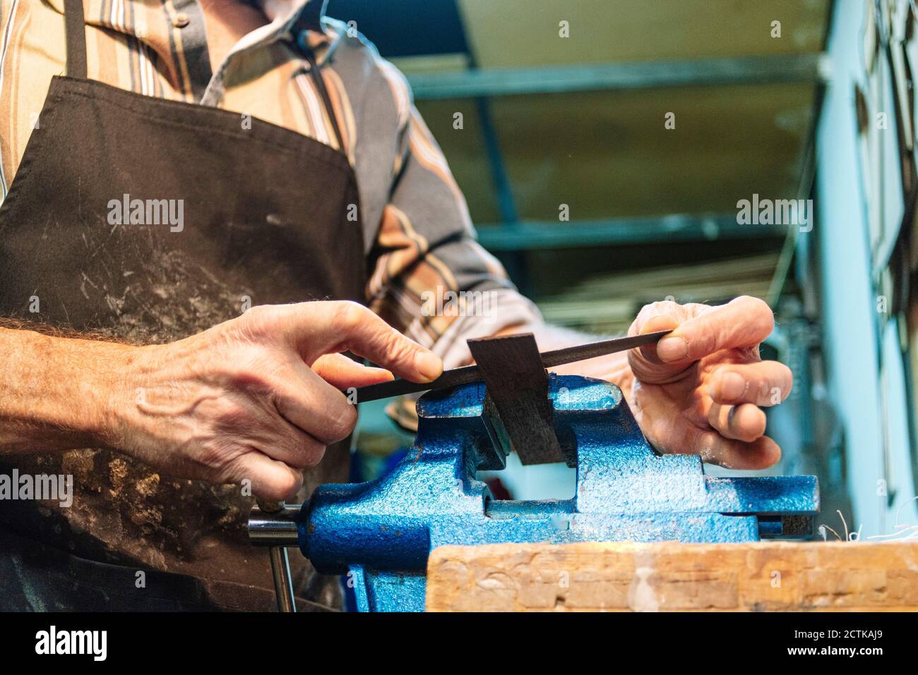 Senior men working while standing at workshop Stock Photo