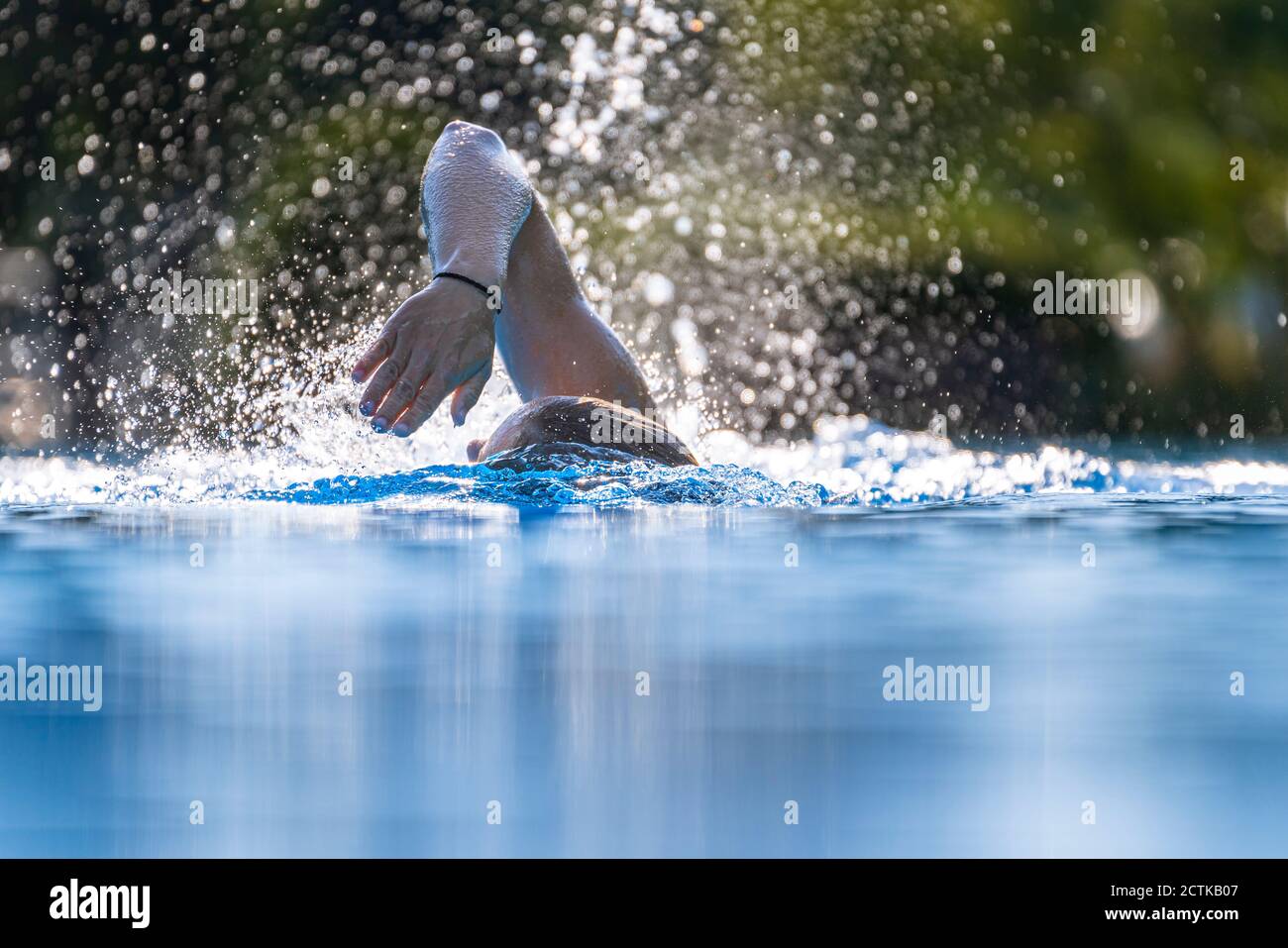 Woman young swimming pool crawling hi-res stock photography and images ...