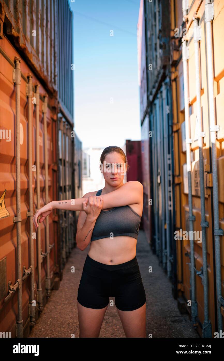 Woman exercising in an industrial park Stock Photo