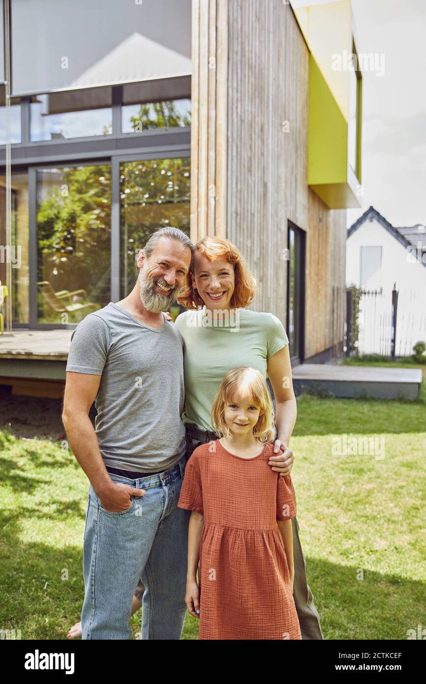 Family standing outside their house hi-res stock photography and images ...