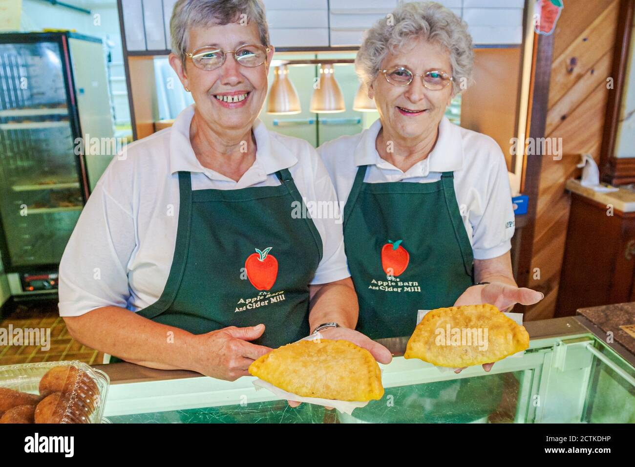 Sevierville Tennessee,The Apple Barn Cider Mill & General Store,woman female women senior seniors employees counter turnover pastries,Americana Stock Photo