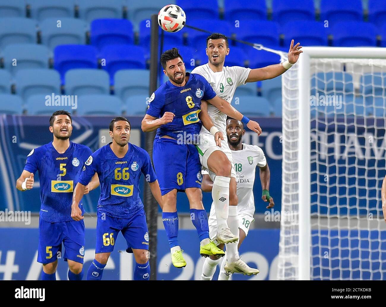 Doha, Qatar. 23rd Sep, 2020. Omar Al Soma (R, front) of Al Ahli Saudi FC  vies with Farshid Esmaeili(L, front) of Esteghlal FC during the AFC Asian  Champions League group A football