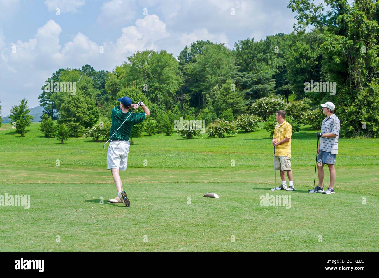 Huntsville Alabama,Hampton Cove Golf Course,man men friends golfer golfers golfing hits hitting driving,081003 T0029 Stock Photo