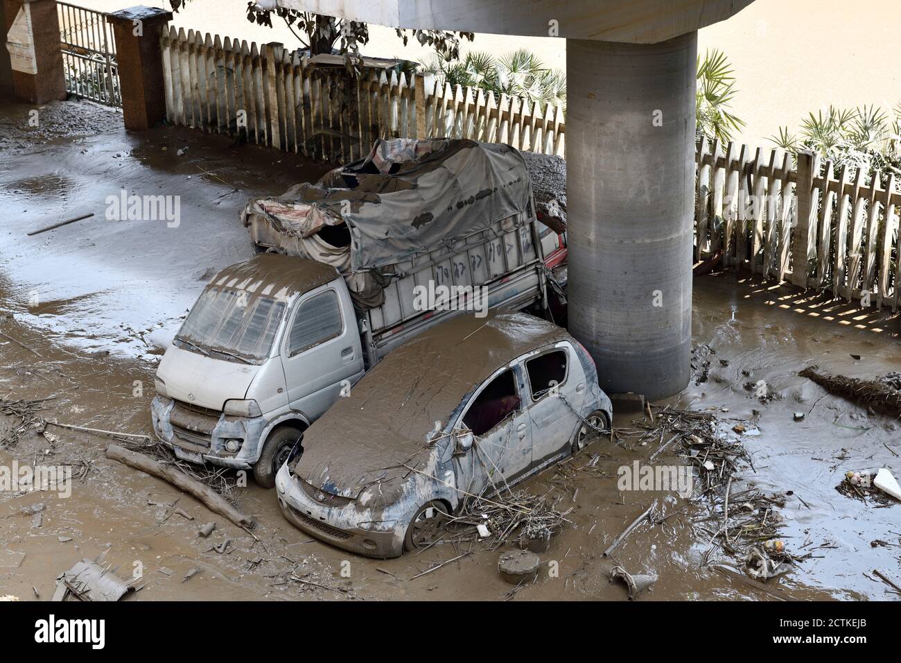 Aerial view of two vehicles covered by silt and mud due to flood in Chongqing, China, 22 August 2020. Stock Photo