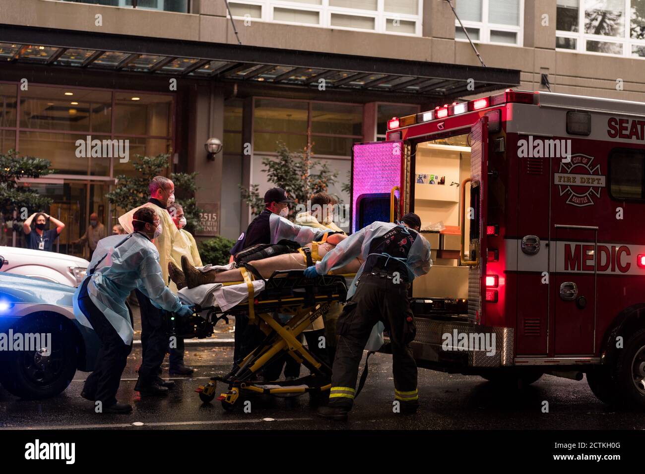 Seattle, USA. 23rd Sep, 2020. Paramedics transport a stabbing victim in