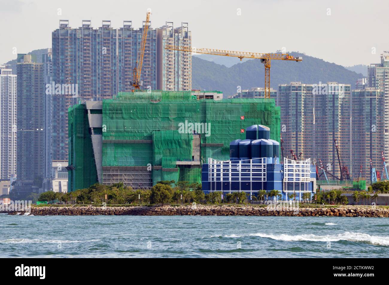 Construction of Hong Kong Palace Museum, West Kowloon Cultural District, in September 2020. Blue building is Western Harbour Crossing tunnel vent. Stock Photo