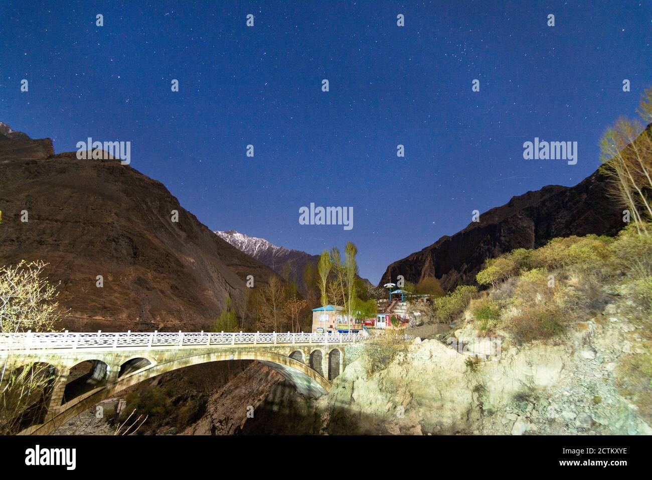 night landscape photography with stars and moon light of Pakistan Stock