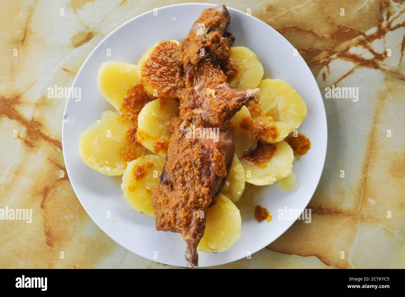 A delicious dish of Peruvian food is the 'cuy chactado'. Stock Photo