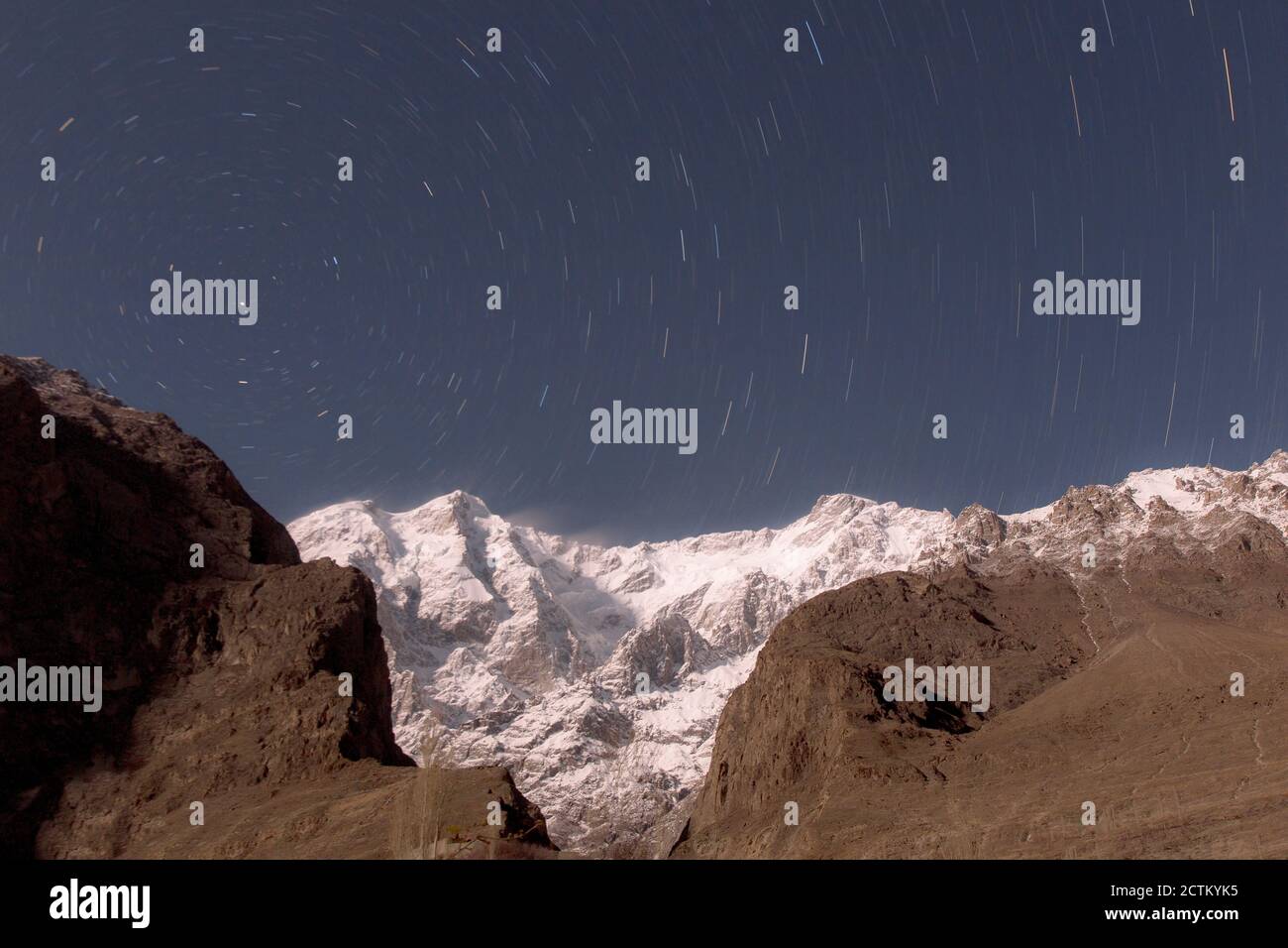 night landscape photography with stars and moon light of Pakistan Stock