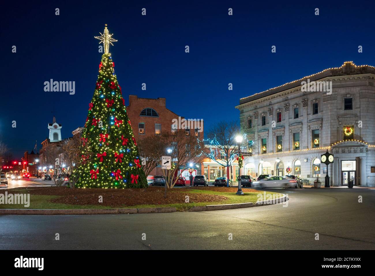 Winter night view of the town square lit up for Christmas, with holiday