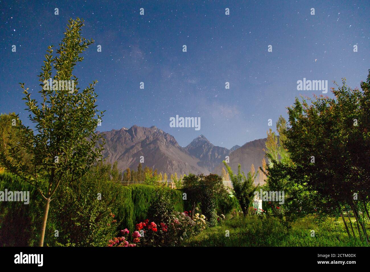 night landscape photography with stars and moon light of Pakistan Stock
