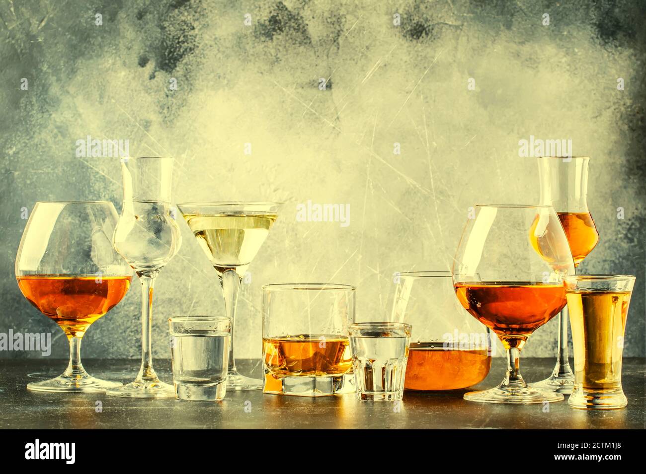 Selection of hard strong alcoholic drinks in big glasses and small shot ...