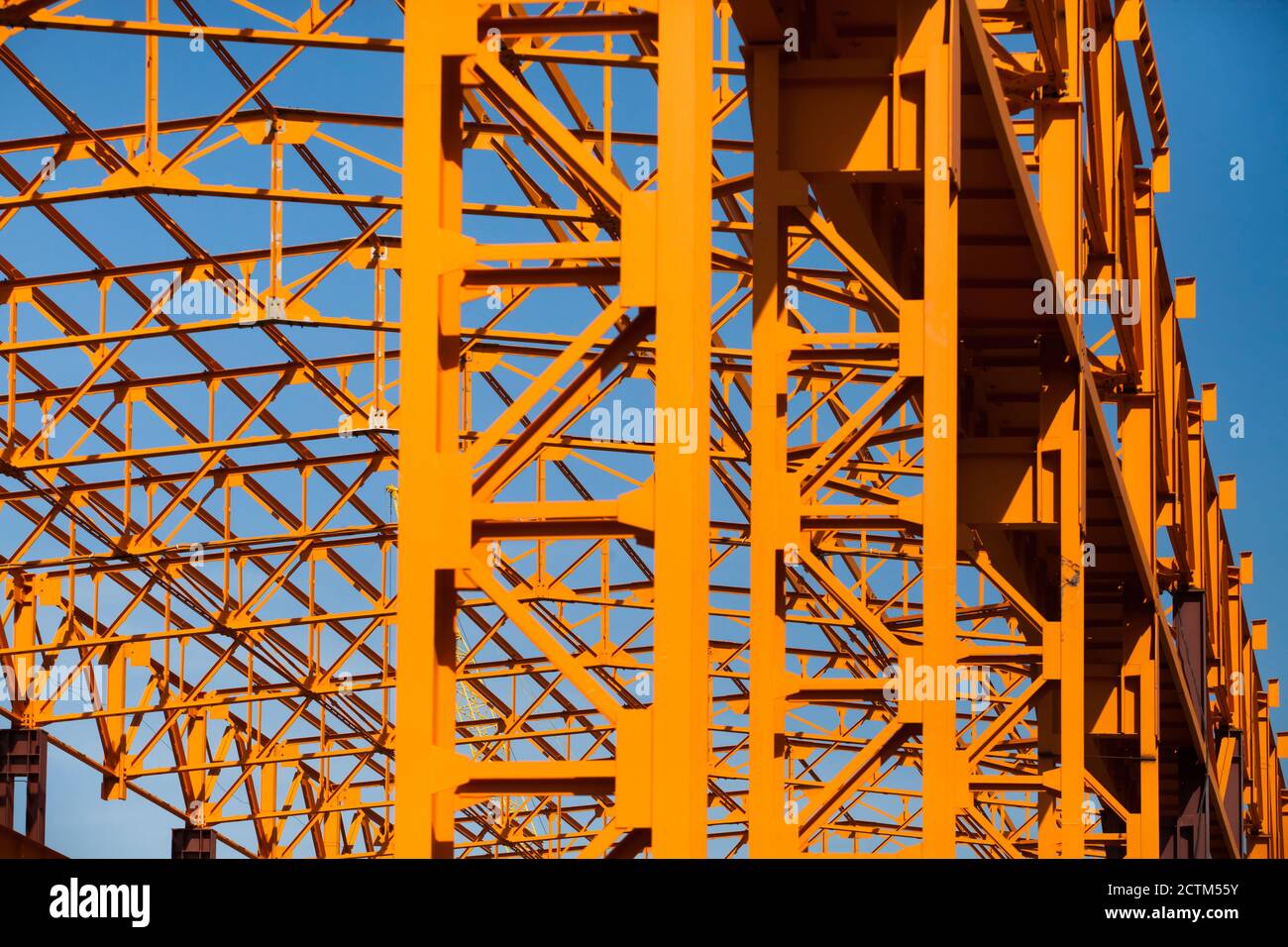 Construction of new factory building orange color painted steel ...