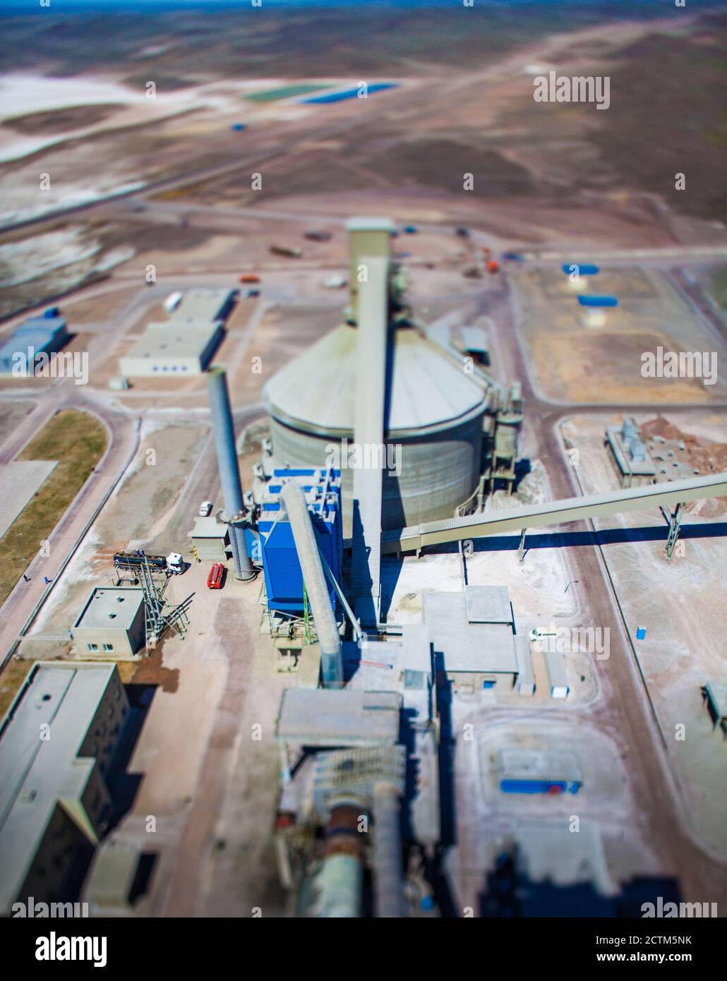 Cement plant silo. Bird-eye view. Tilt-shifted photo. Mynaral, Kazakhstan, lake Balkhash. Stock Photo