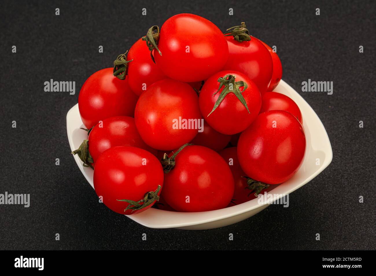 Ripe juicy red cherry tomato in the bowl Stock Photo - Alamy