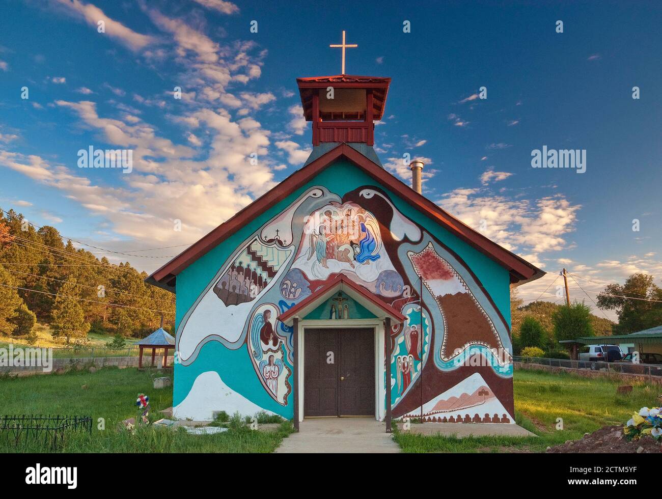 Village church, covered with religious paintings, at sunrise, in