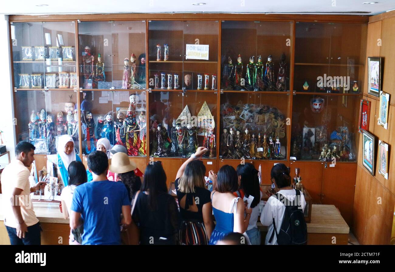 Jakarta, Indonesia October 3, 2019 Visitors buy souvenirs in a shop in the puppet museum