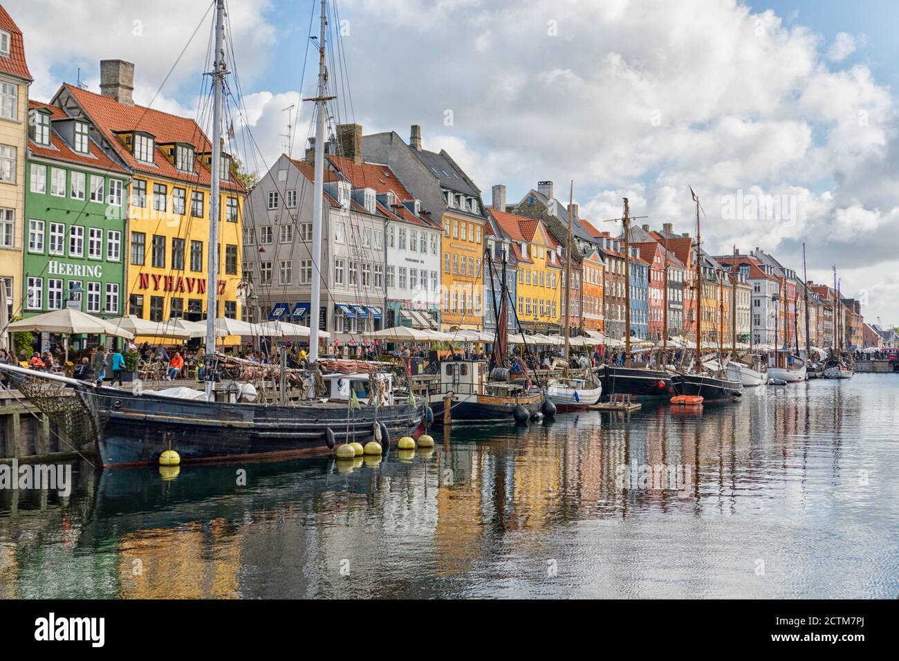 The Nyhavn Canal in Copenhagen, Denmark is a popular tourist destination Stock Photo