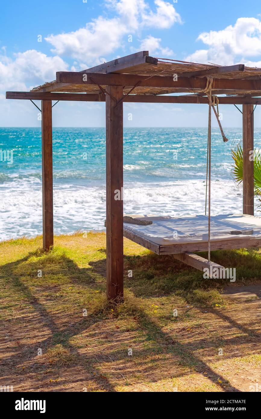 Pillow on beach sofa bed with lounge, ocean sea and blue sky, travel
