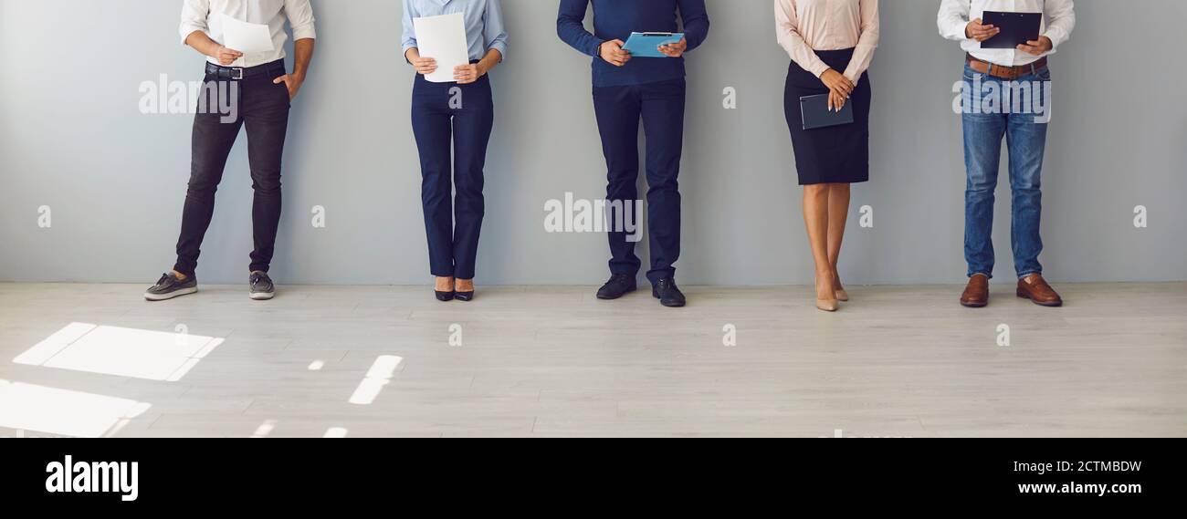 People waiting for job interview or workers waiting for boss's invitation to sign their papers Stock Photo