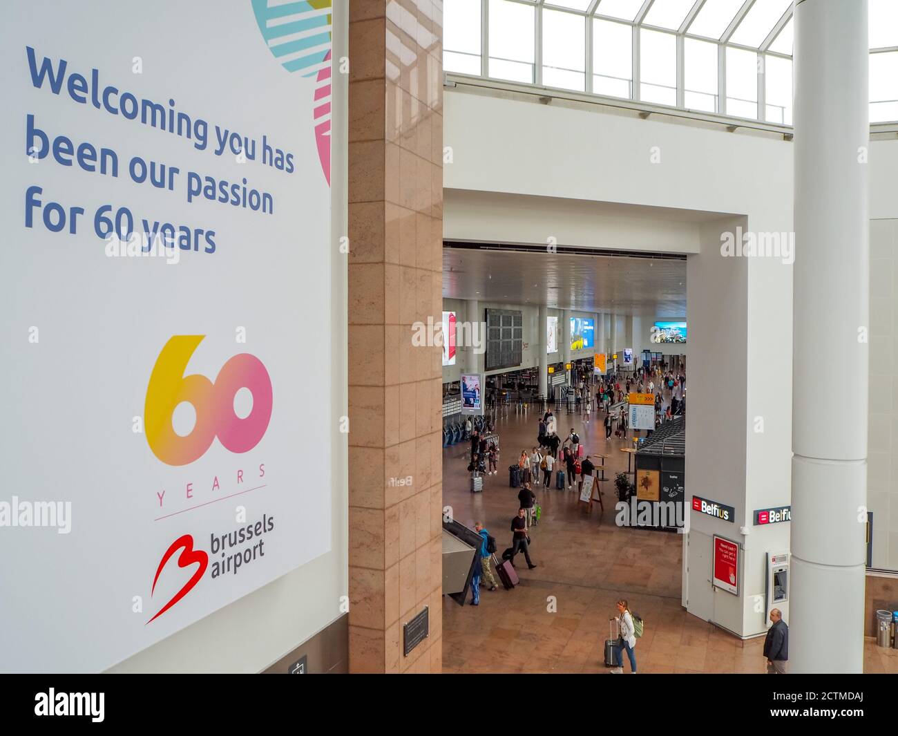 August 2018 - Zaventem, Belgium: Large banner celebrating the 60th anniversary of Brussels Airport hanging in the check-in hall of the airport. Stock Photo