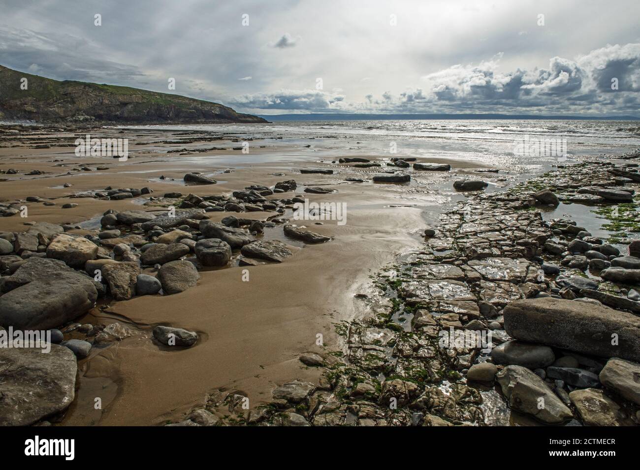 Dunraven Bay, also known as Southerndown Beach, on a moody an grey day, with the tide receding back into the Bristol Channel. Glamorgan Heritage Coast. Stock Photo