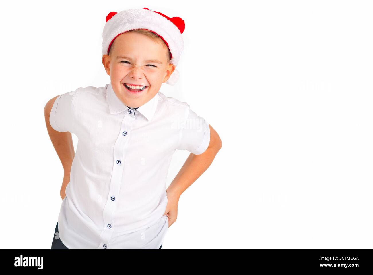 A young caucasian boy showing hand gesture. Kid portrait gesturing with fingers against. Funny emotions, facial expression, body language. Stock Photo