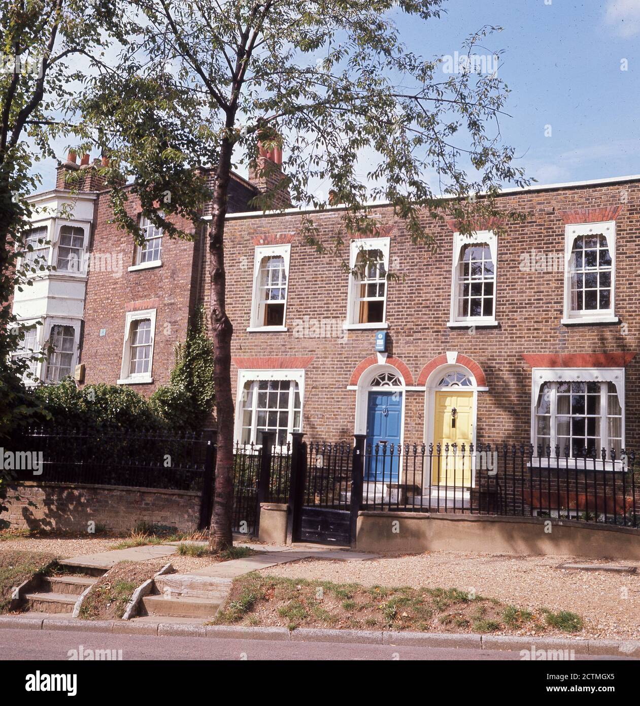 1960s, exterior picture from this era of attractive two-storey semi-detached Georgian cottages in Hampstead village, North London, England. These properties were built in the Georgians era between 1714 and 1830 and are now highly valued and sort after in a prestigious London location. Stock Photo