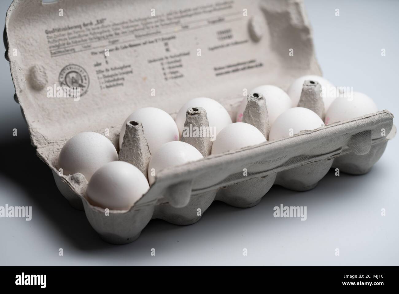 Ten raw white eggs in a box Stock Photo - Alamy