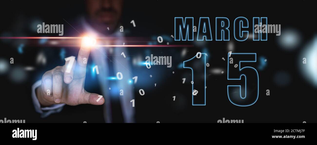 march 15th. Day 15 of month, advertising or high-tech calendar, man in suit presses bright virtual button spring month, day of the year concept. Stock Photo