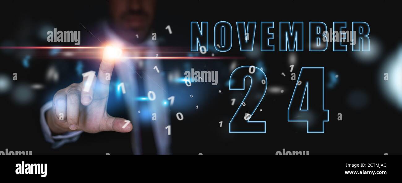 november 24th. Day 24 of month, announcement of date of business meeting or event. businessman holds the name of the month and day on his hand. autumn Stock Photo
