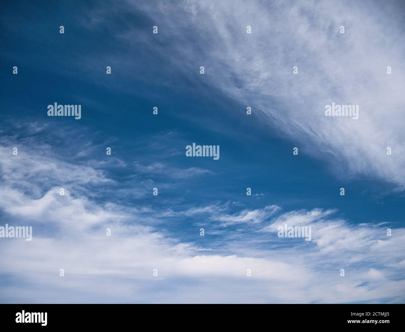Blue sky with high white clouds Stock Photo - Alamy