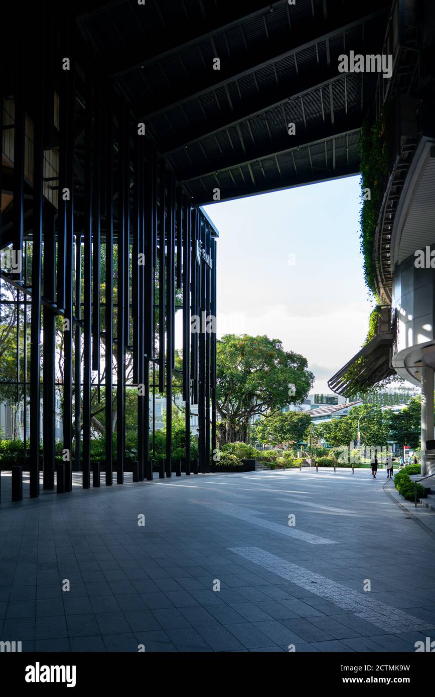 SINGAPORE, SINGAPORE - Sep 10, 2020: Two students walking at Singapore Management University campus. Vertical shot Stock Photo