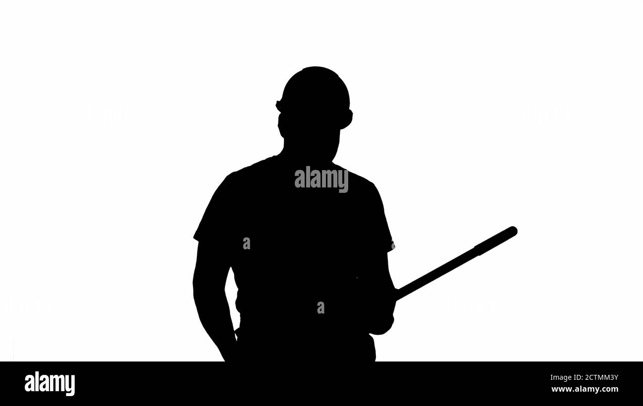 Silhouette Cheerful man playing on the swob like it is a guitar. Stock Photo