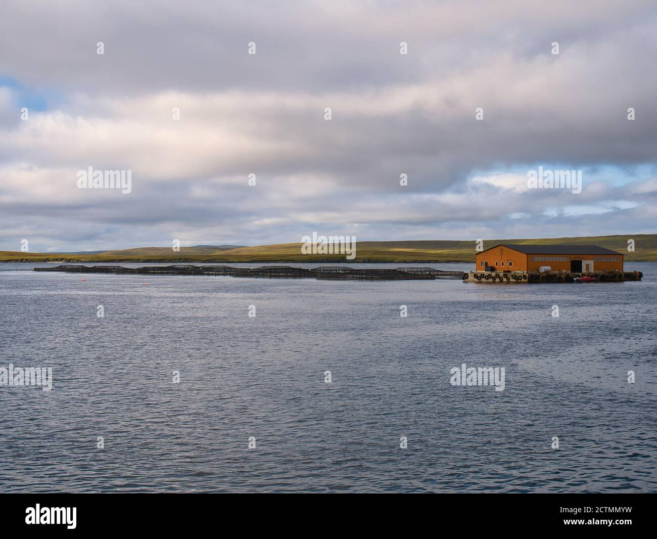 Aquaculture / fish farming in Bluemull Sound between the islands of Yell and Unst in Shetland - an archipelago of islands in the north of the UK Stock Photo