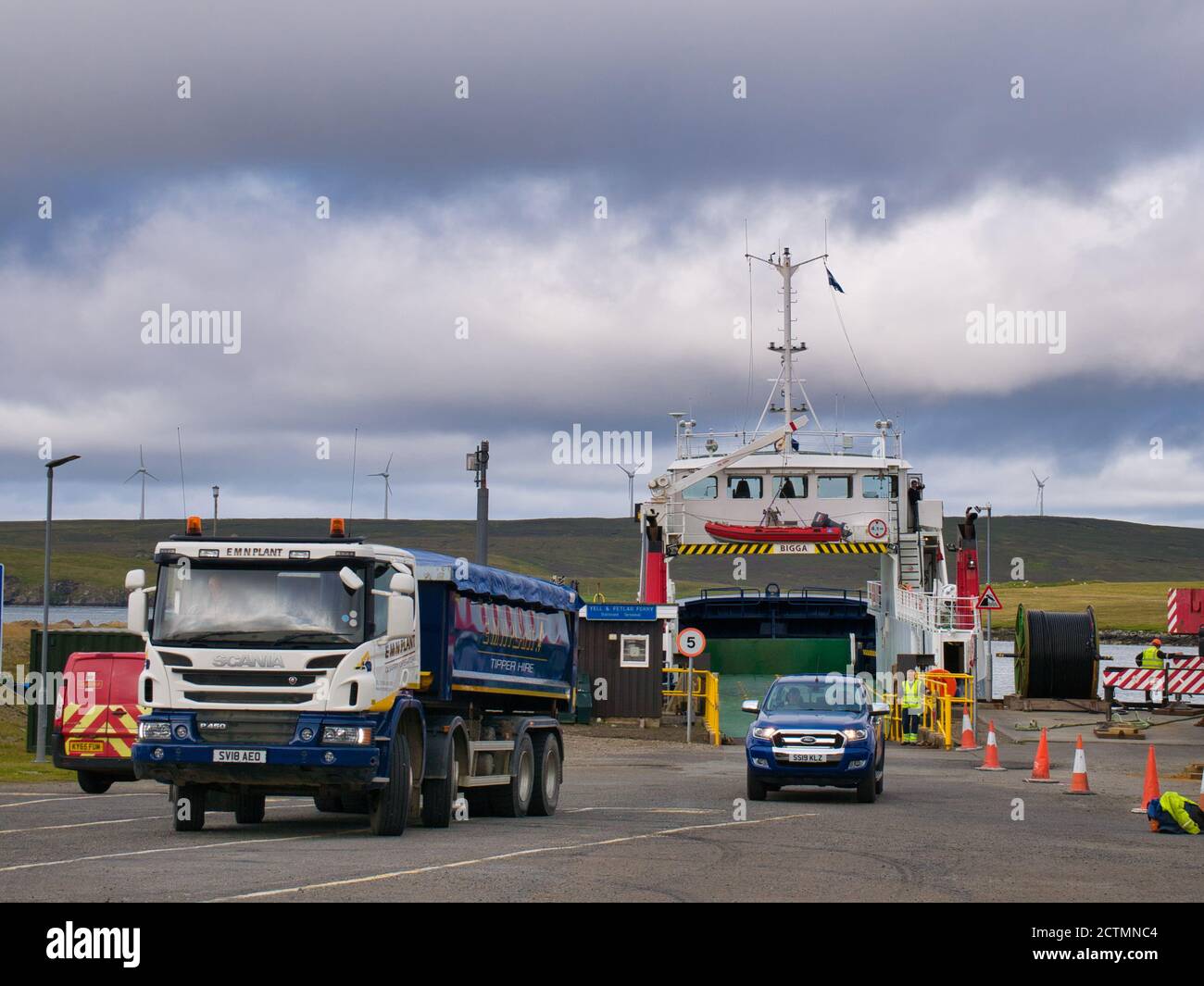 Vehicles leave the inter-island roro car ferry MV Bigga at the Gutcher ferry terminal on the island of Yell in Shetland, UK Stock Photo