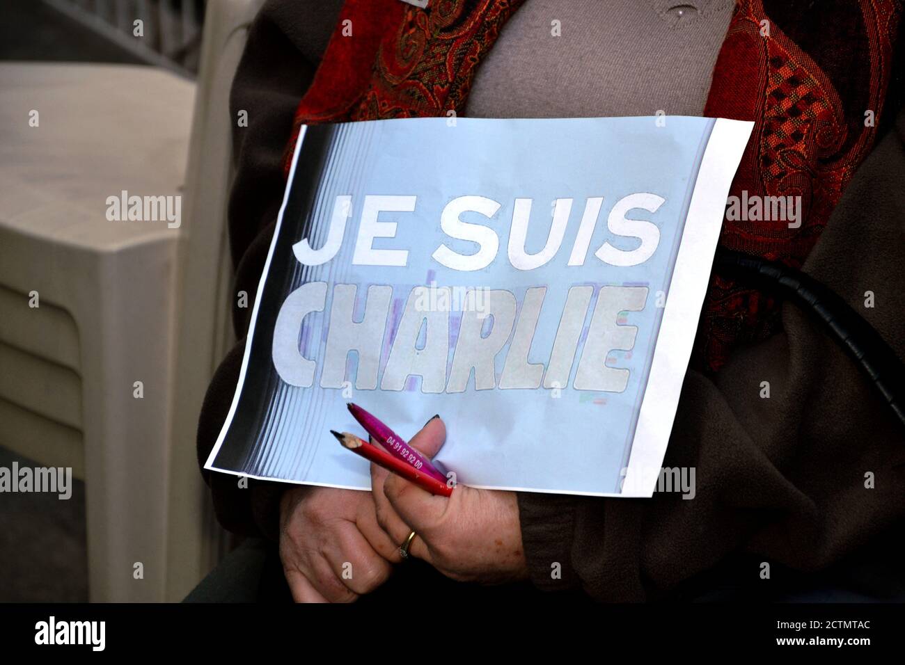 A woman holds a poster, written on 'Je suis Charlie'.Nearly a hundred media, newspapers, magazines, television channels and radio stations, call on the French to mobilize in favor of freedom of expression, in support of Charlie Hebdo, which has been the subject of new threats since the republication of Muhammad caricatures. The ongoing trial of the attack on the newspaper, which killed 12 on January 7, 2015, will be held until November 10, 2020. Stock Photo