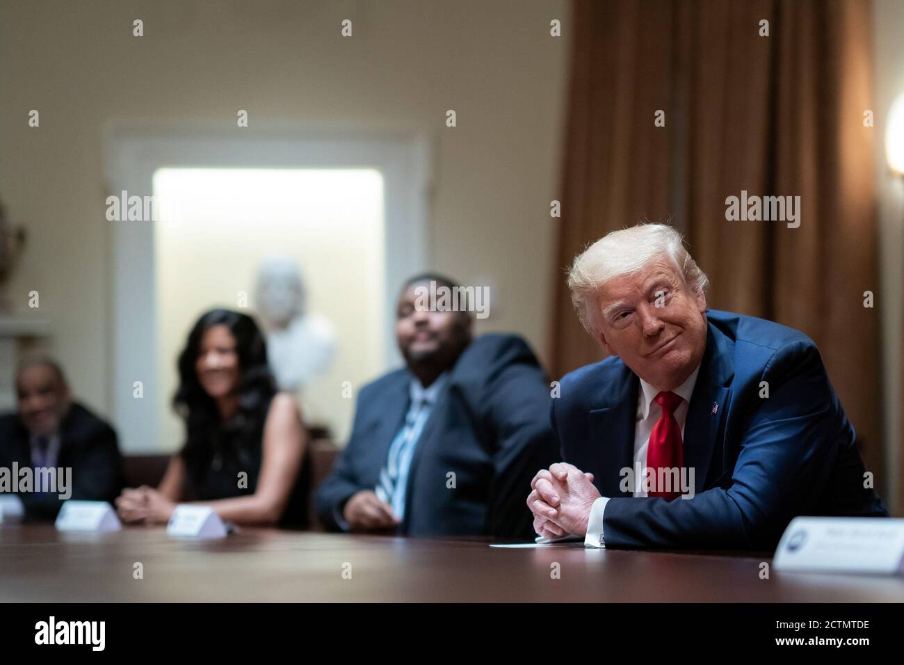 President Trump Participates in a Roundtable on Race Relations. President Donald J. Trump listens to participants address their remarks during a roundtable on race relations Wednesday, June 10, 2020, with prominent black leaders in the Cabinet Room of the White House. Stock Photo