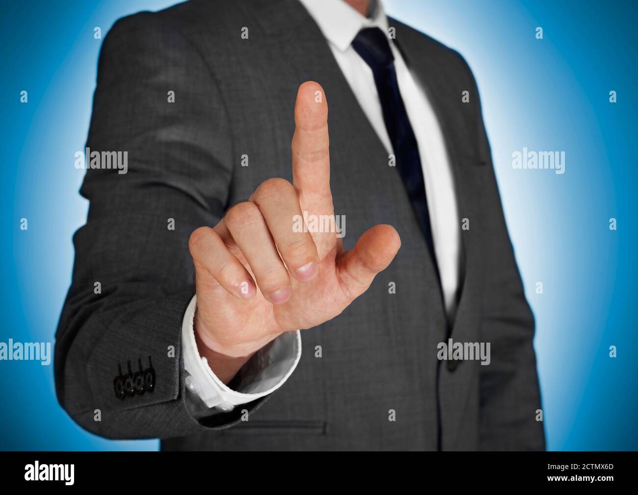 Businessman touching a virtual screen Stock Photo