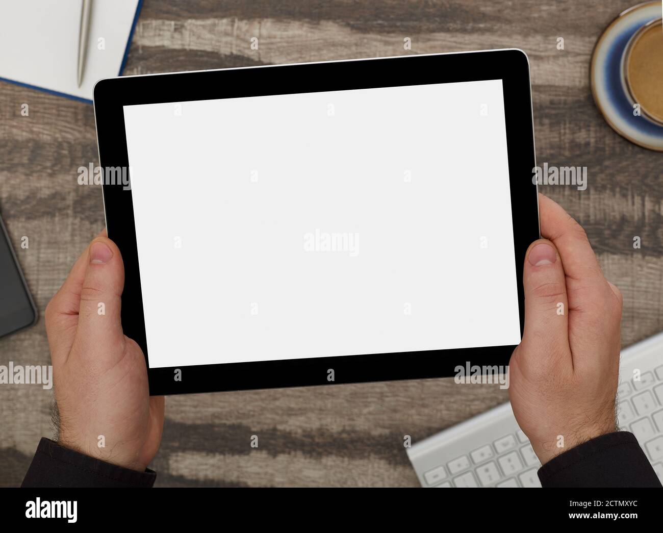 Man holding a digital tablet with blank screen Stock Photo - Alamy